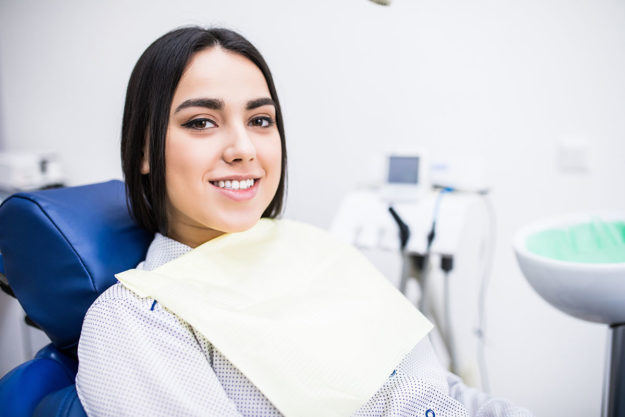 Root Canal Recovery- Everything To Expect From Your Root Canal Surgery woman undergoing root canal surgery