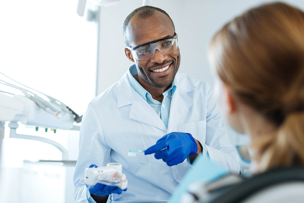 3 Reasons to Make an Endodontist Appointment endodontist speaking with patient about importance of endodontic appointments