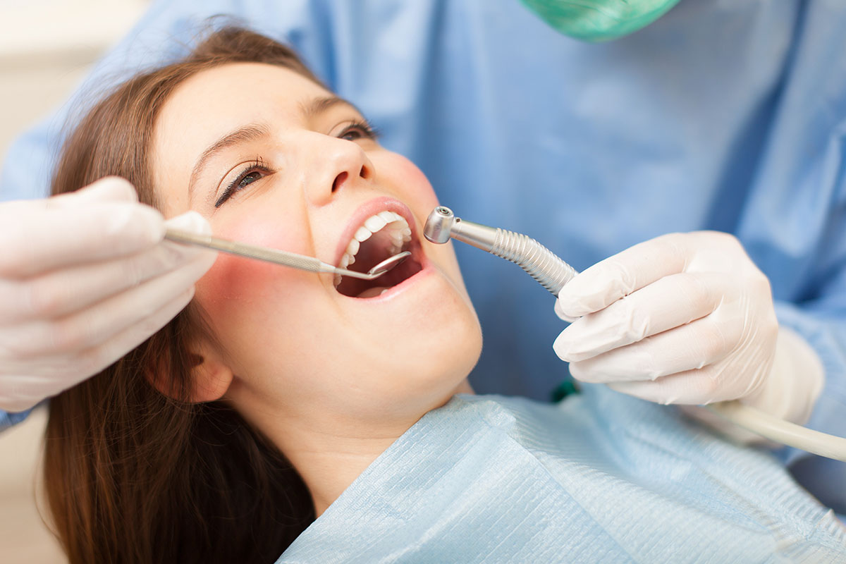 What is a Pulpotomy_ girl with brown hair going through a pulpotomy