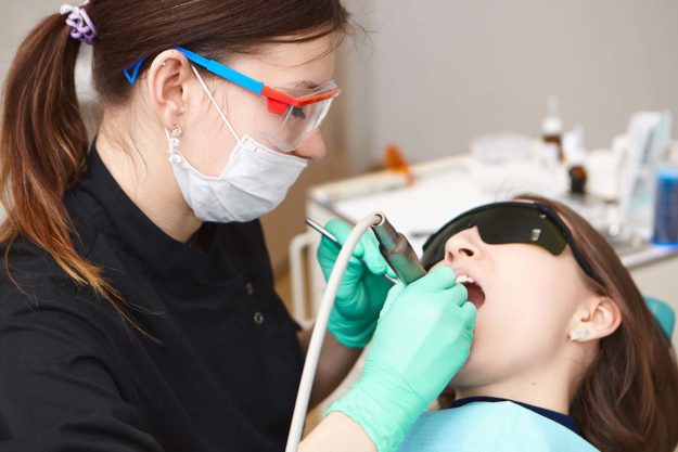 Laser-Assisted Irrigation Recovery person feeling relief from pain after making an appointment for endodontic services