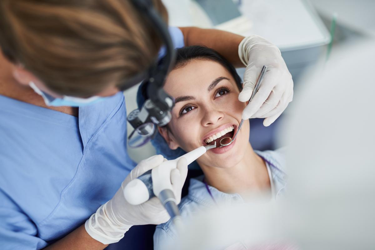 How Is Dental Trauma Treated_ woman at an endodontist's office learns about ways of treating dental trauma