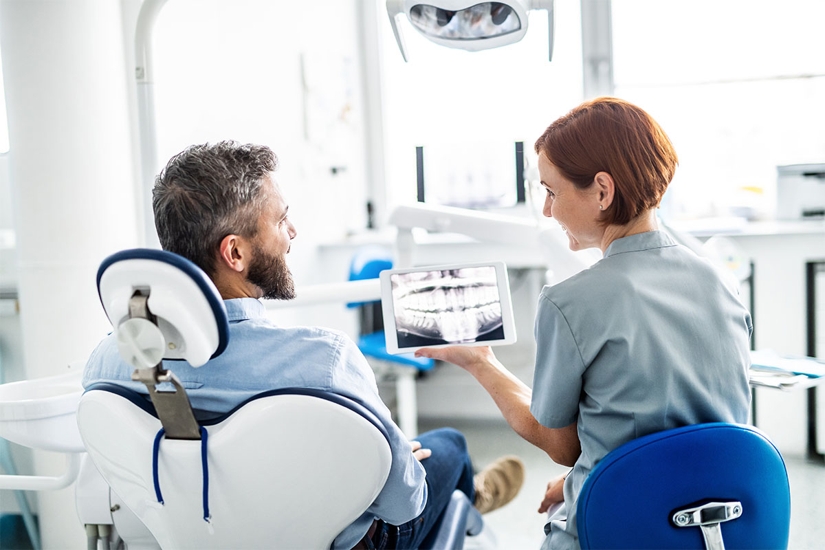 Is There A Difference Between Endodontics and Orthodontics an endodontist meets with a patient