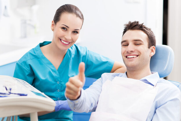Laser Dentistry- Is it More Expensive man gives thumbs up after talking with endodontist about Is laser dentistry more expensive