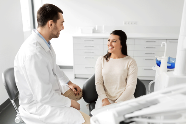 Advantages-of-Laser-Technology-in-Edodontic-Disinfection a woman speaks to her endodontist about laser assisted services