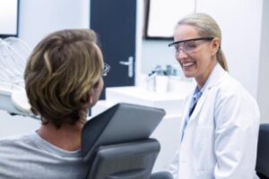 an endodontist eases a patient through root canal retreatment 